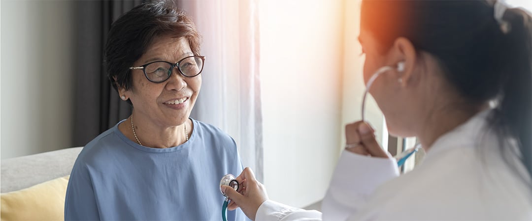 A doctor smiling with a patient.